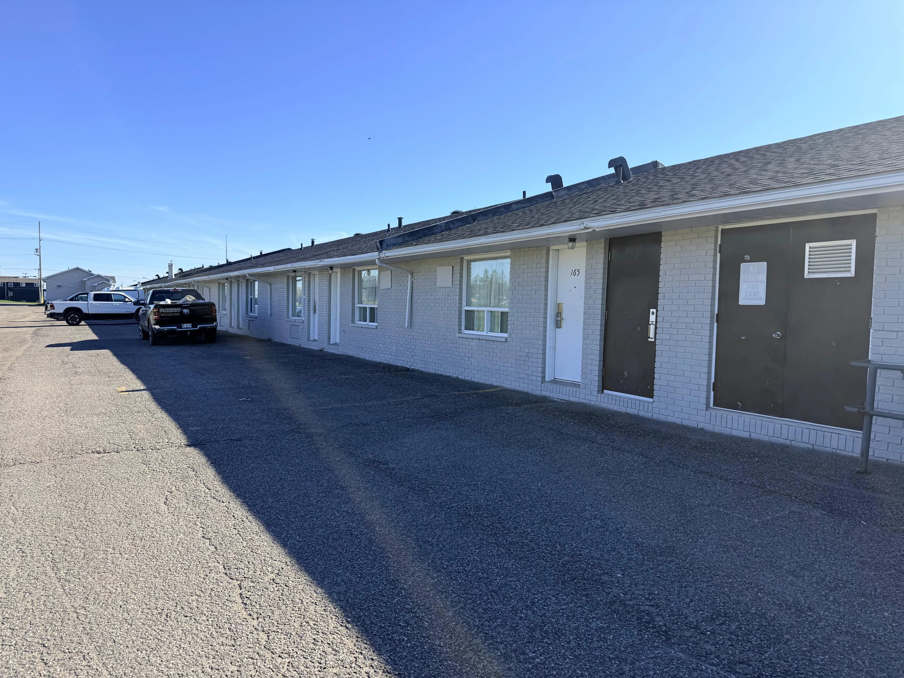Quality Inn, New Liskeard — Finished return at the service end, with the crew trucks still on site