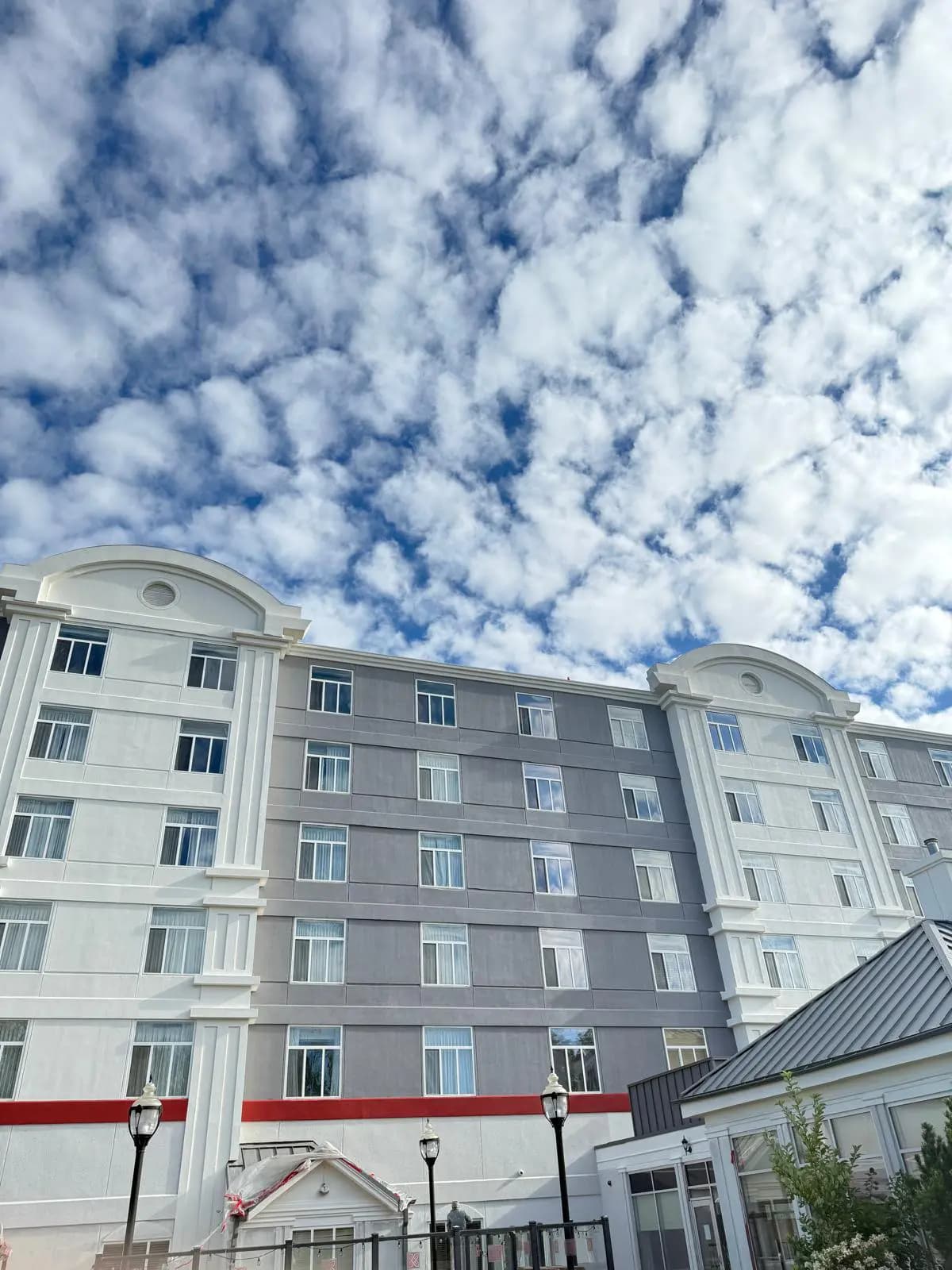 Hilton Garden Inn, Edmonton — Arched parapets and the red band along the courtyard side