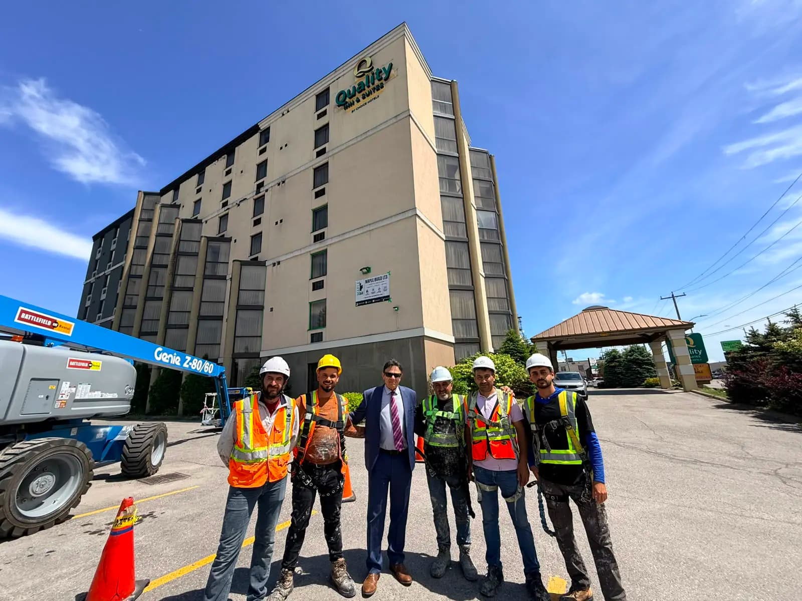 Quality Inn, Sault Ste. Marie — Crew and owner on site at the start, with the building still beige